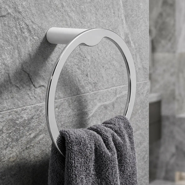 Towel rack with a towel on a stone wall in a bathroom setting