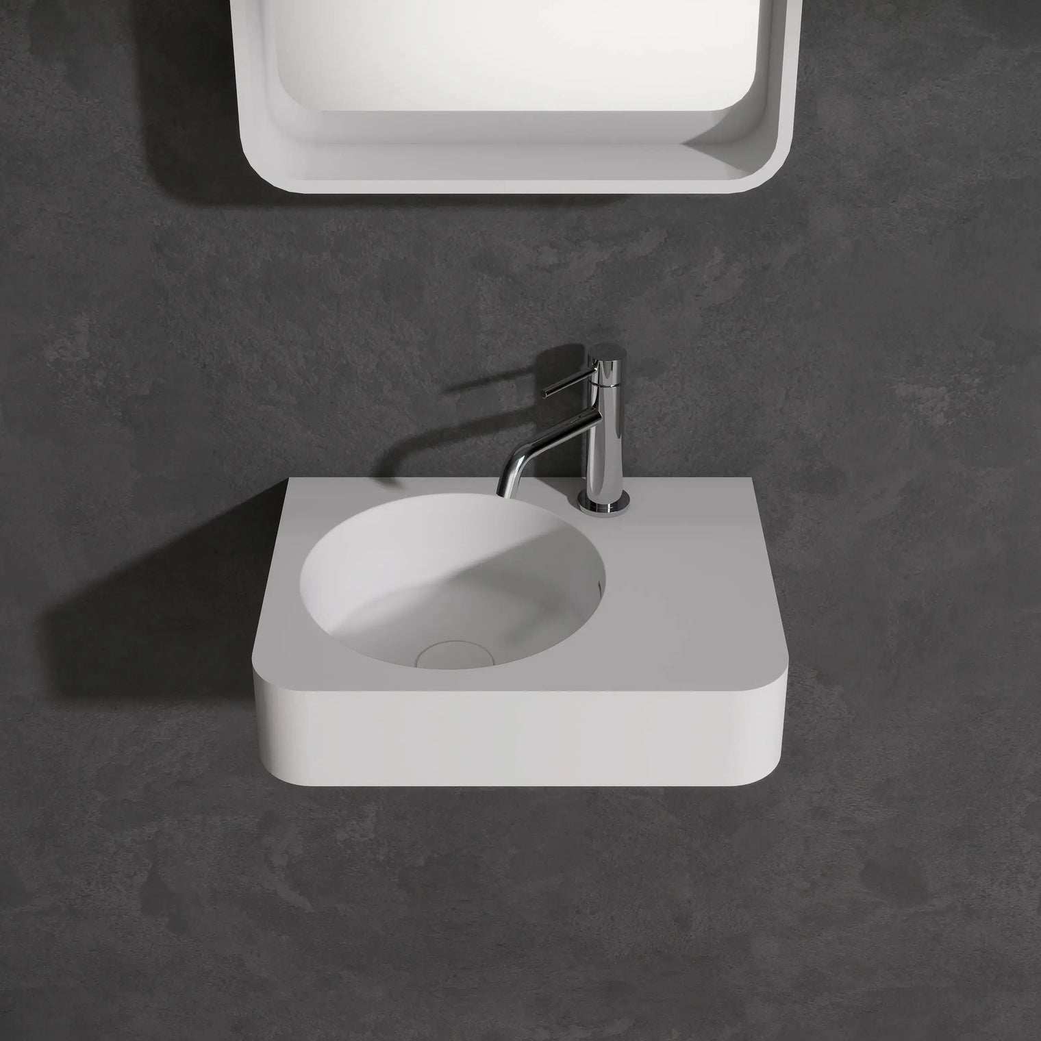 Bathroom sink with faucet against a dark wall