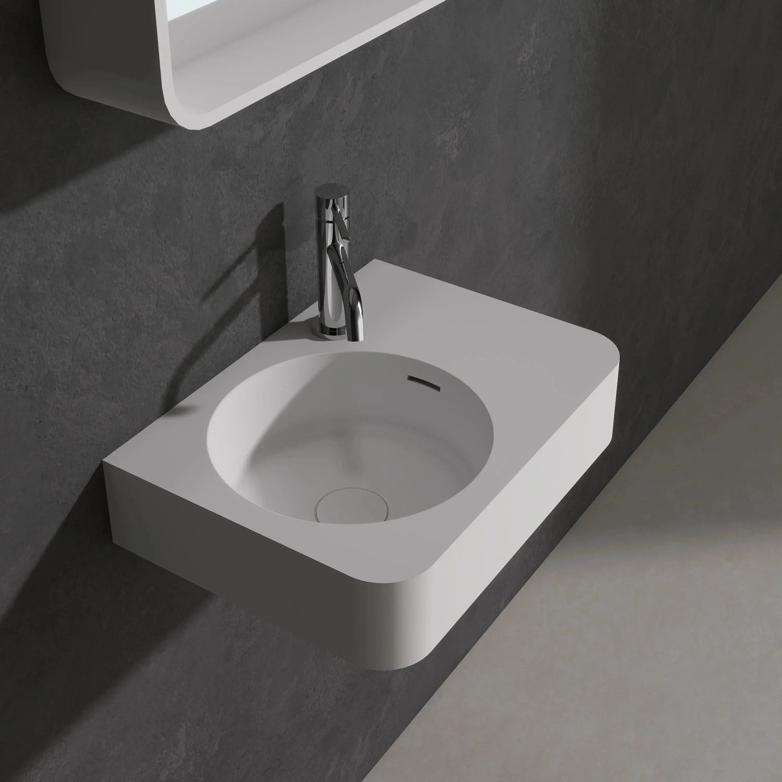 Modern bathroom sink with faucet against a dark wall