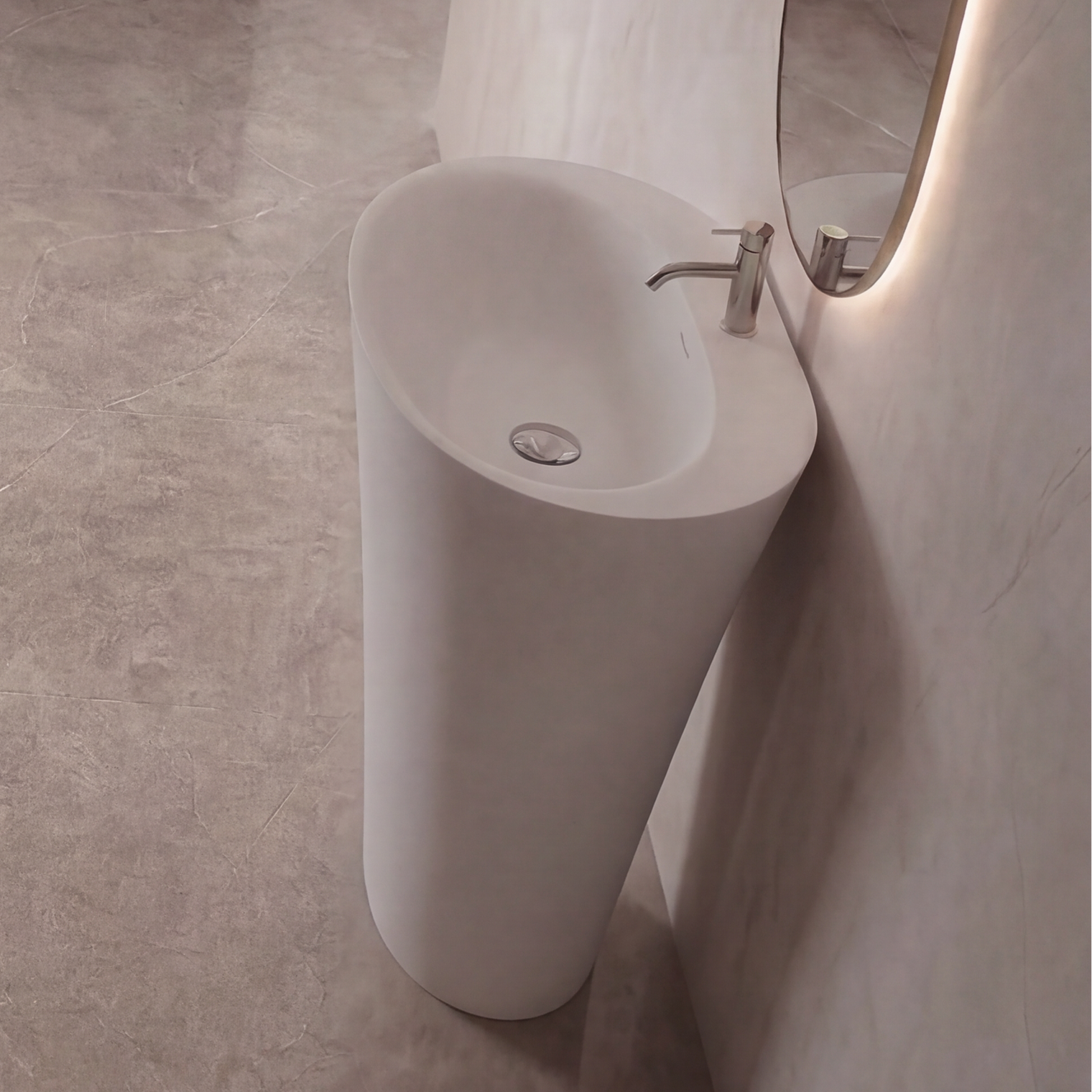 Modern bathroom with freestanding bathtub, sink, and vanity.