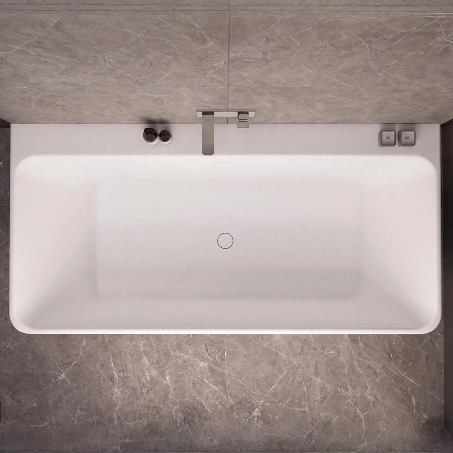 Top-down view of a modern white rectangular bathtub with a chrome faucet, set against dark gray marble-look tiled walls and floor.