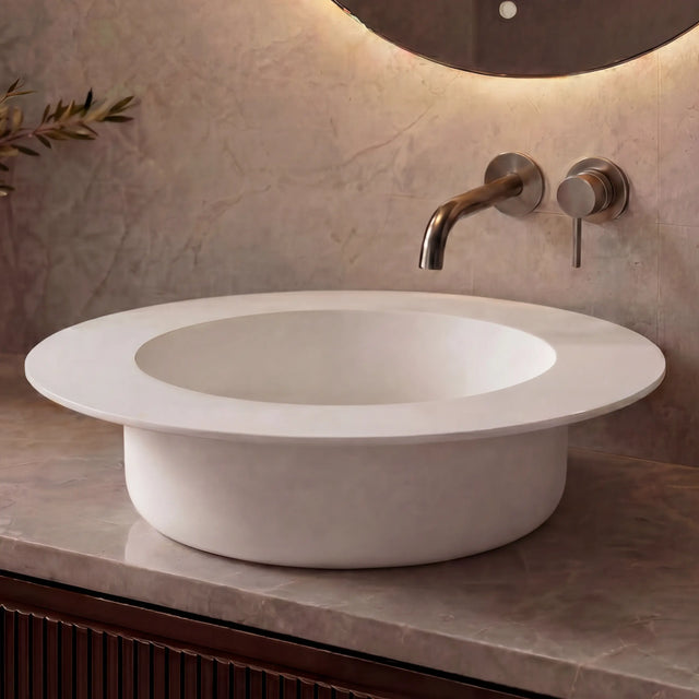 Modern bathroom sink with faucet against a neutral wall