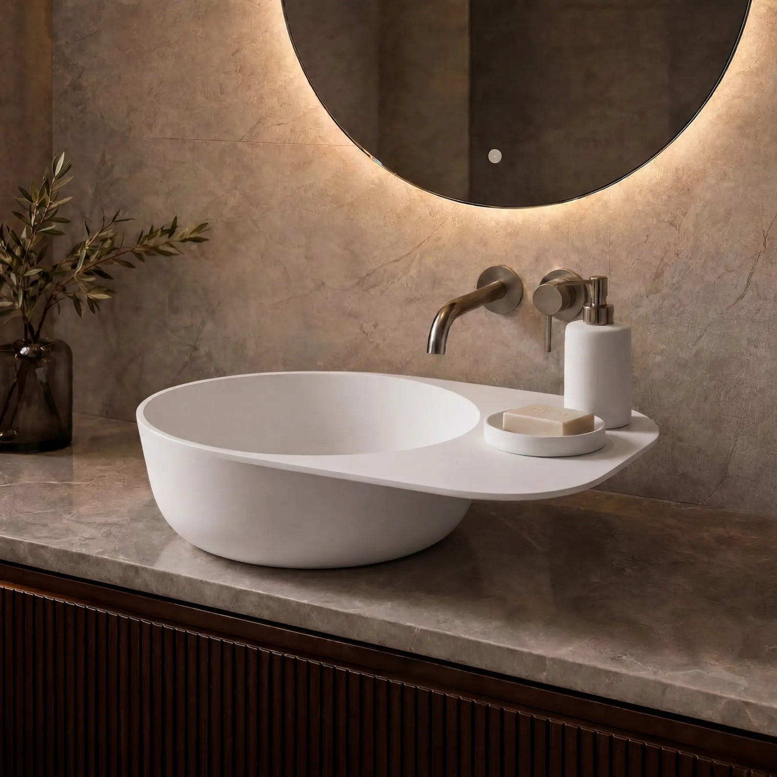 Modern bathroom vanity with a white sink, faucet, and decorative elements.
