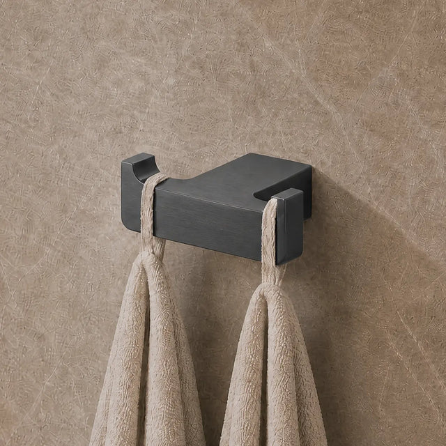 Towel rack with towels on a textured wall in a bathroom setting