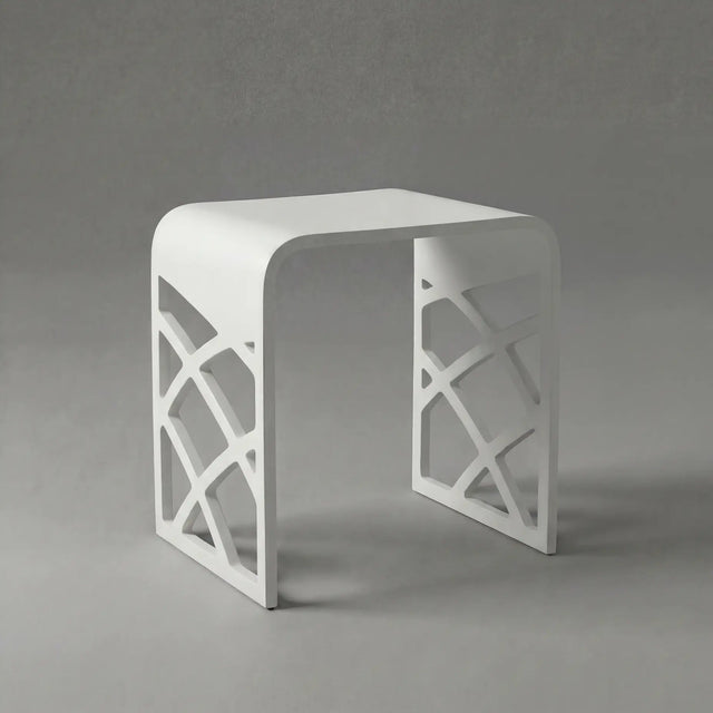 White stool with lattice design on a gray background
