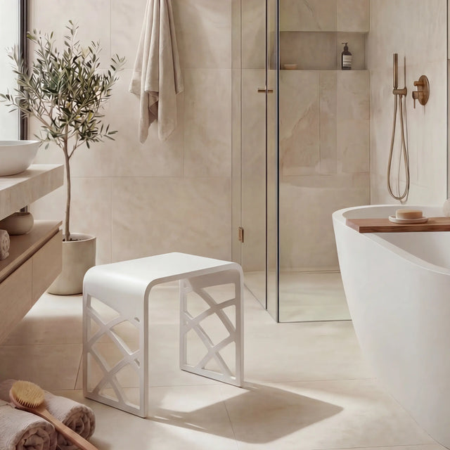 Modern bathroom with a freestanding bathtub, sink, and shower area.