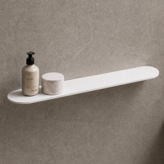 White shelf on a gray wall with bathroom items and a mirror.