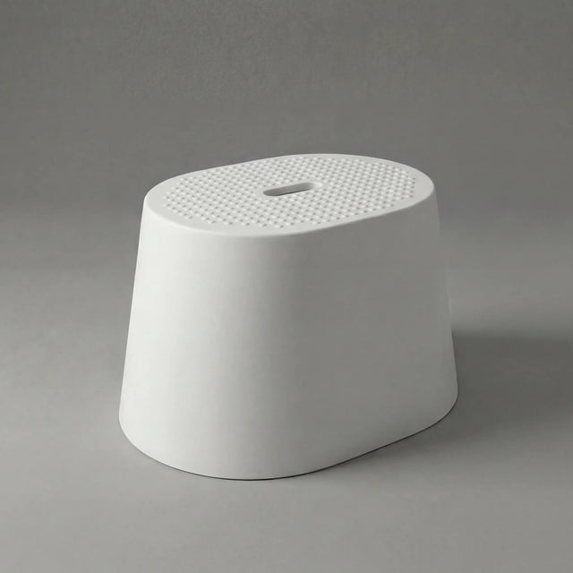 White textured stool on a gray background