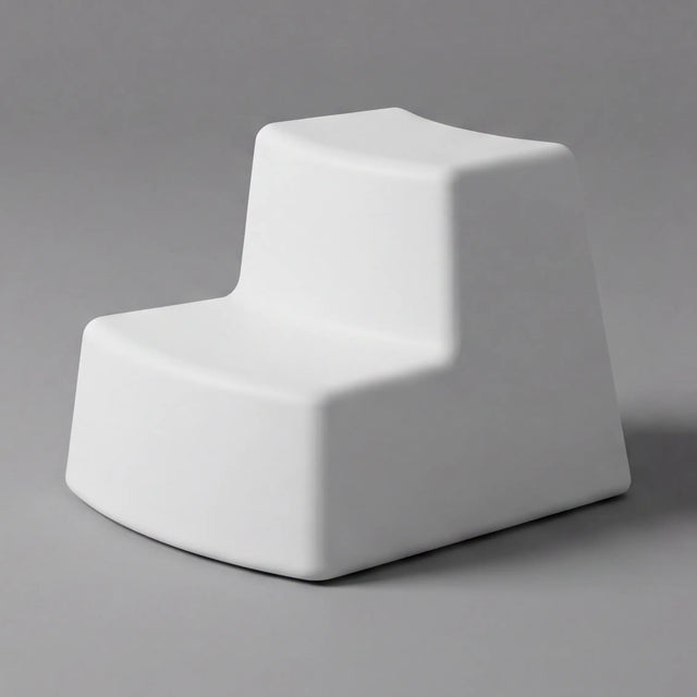 White geometric sculpture on a gray background