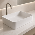 Modern bathroom sink with faucet on a light-colored countertop