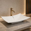 Modern bathroom solid surfaces sink with faucet on a marble countertop