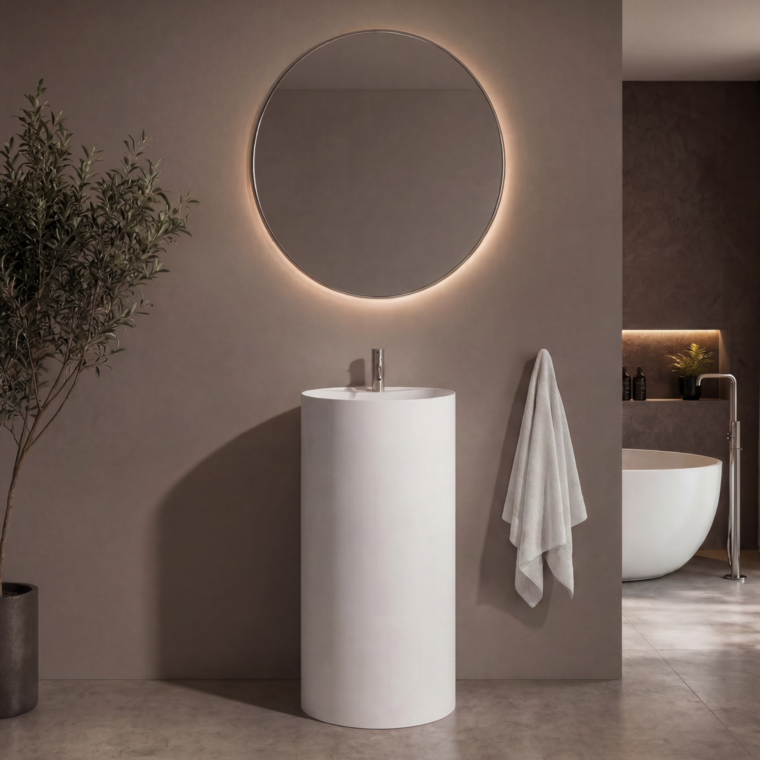 Modern bathroom with a round mirror, pedestal sink, and plant.