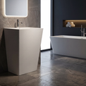 Modern bathroom with a freestanding sink and bathtub.