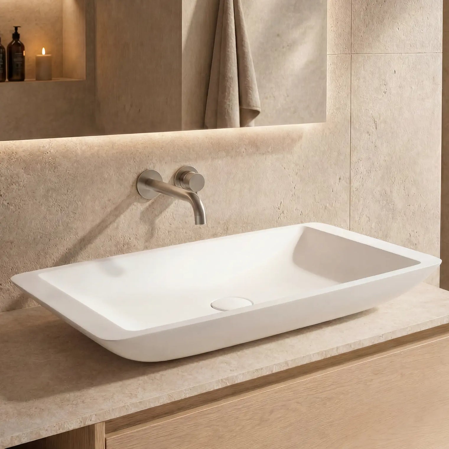Bathroom vanity with a white sink and wooden cabinet.