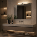 Modern bathroom with a vanity, mirror, and decorative elements.