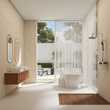 Modern bathroom with a bathtub, shower, and large windows.