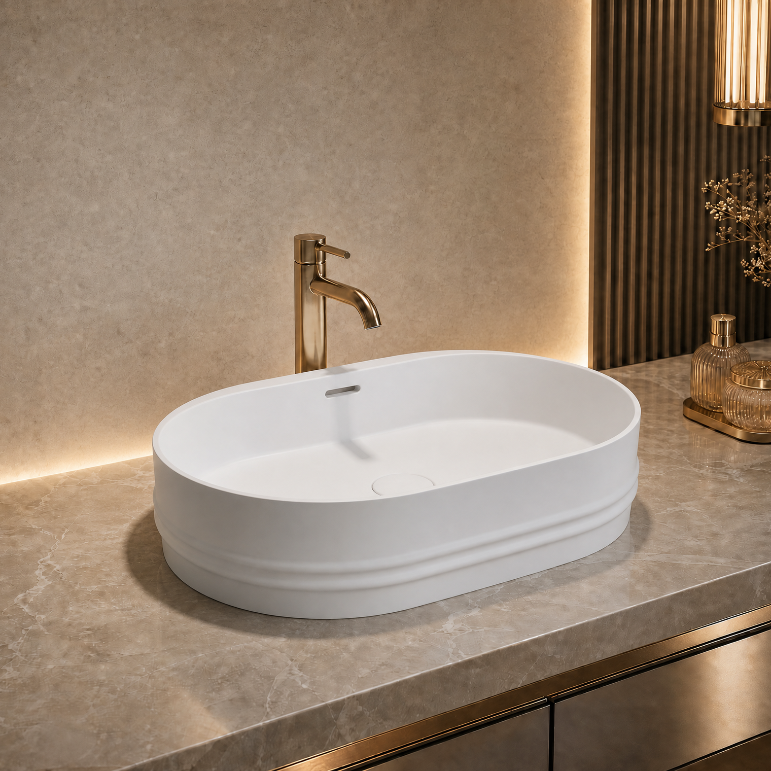 White oval Solid Surfaces sink on a gray countertop with a gold faucet in a modern bathroom setting.