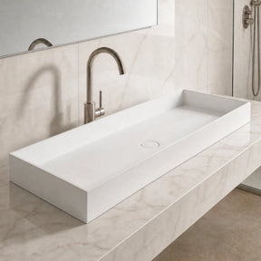 Modern bathroom sink with faucet in a marble-like setting