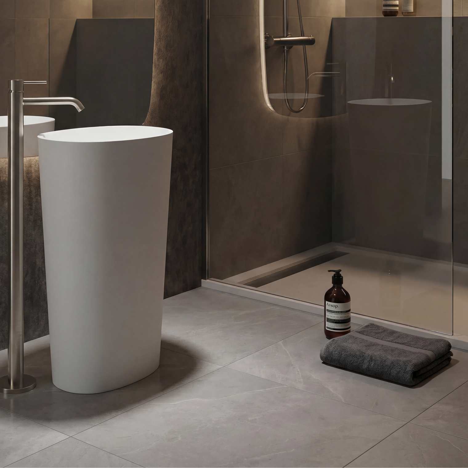 Modern bathroom with a freestanding white sink and shower area.