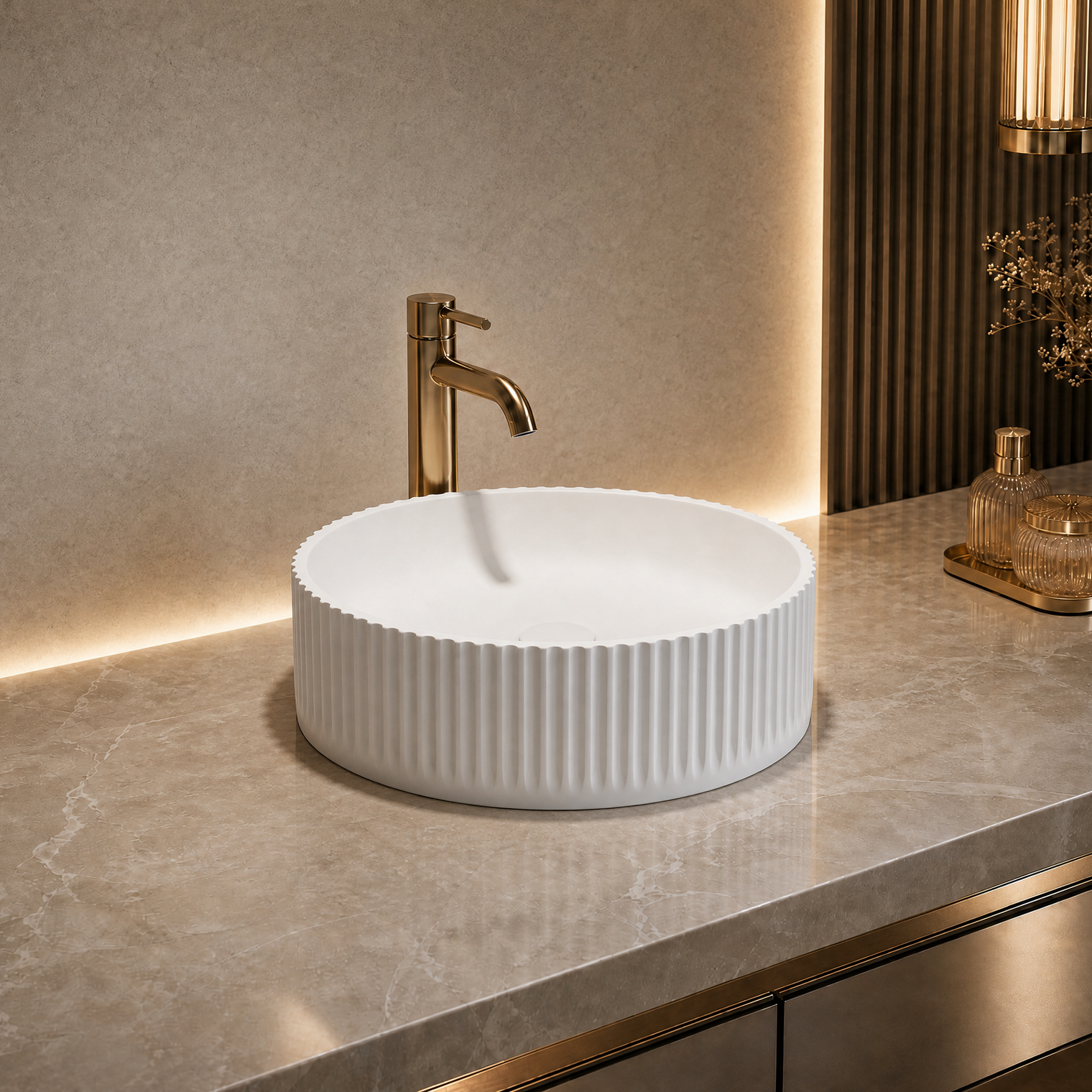 White ribbed Solid Surfaces sink on a marble countertop with a gold faucet