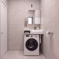 A compact bathroom setup featuring a white front-loading washing machine integrated beneath a matching white sink and mirror, set against light gray tiled walls and floor.
