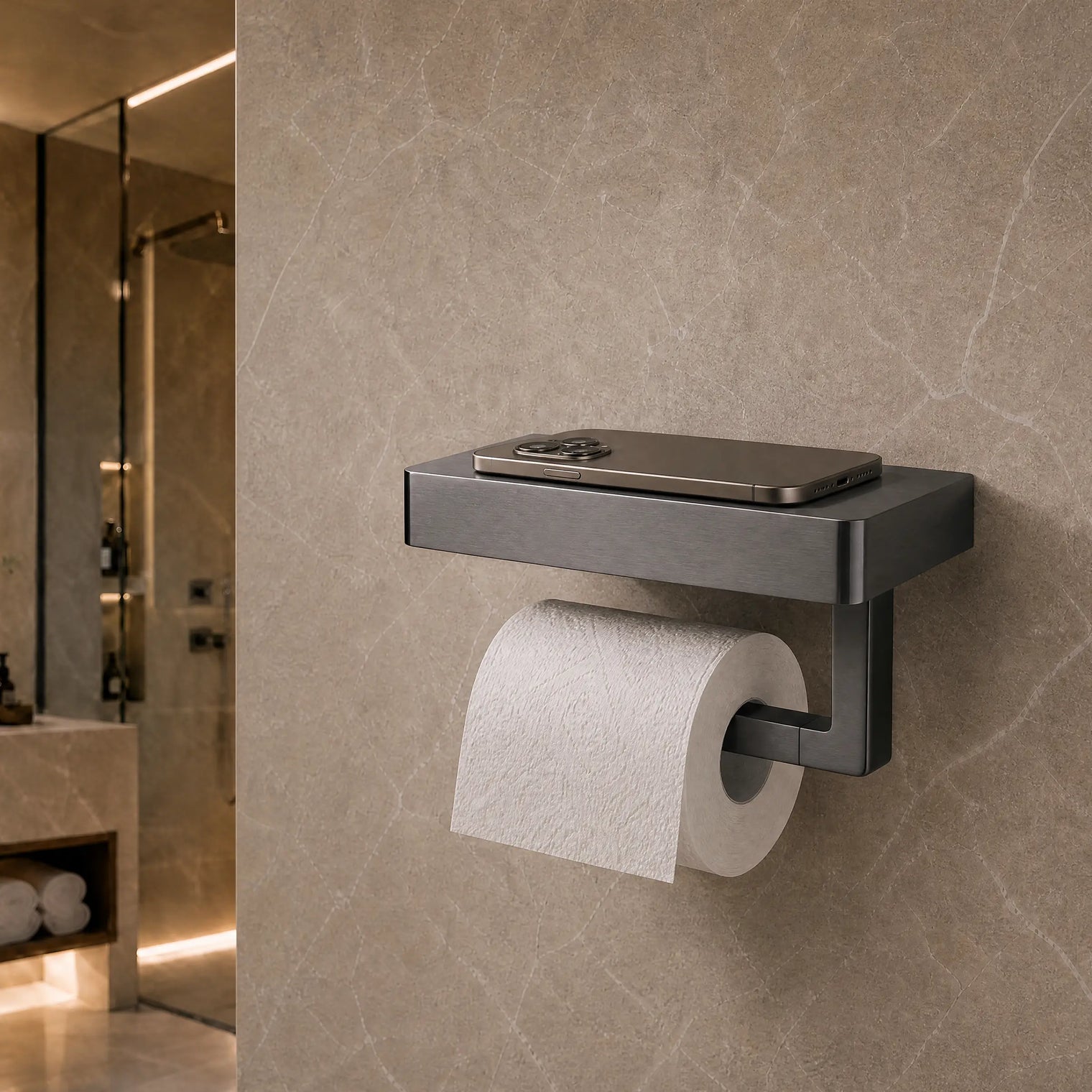 Modern black toilet paper holder with a roll of toilet paper on a beige tiled bathroom wall.