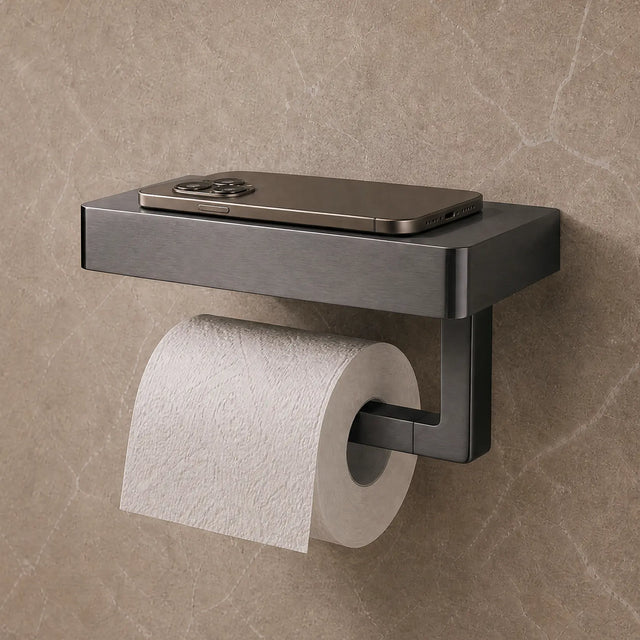 Modern black toilet paper holder with a roll of toilet paper on a beige tiled bathroom wall.