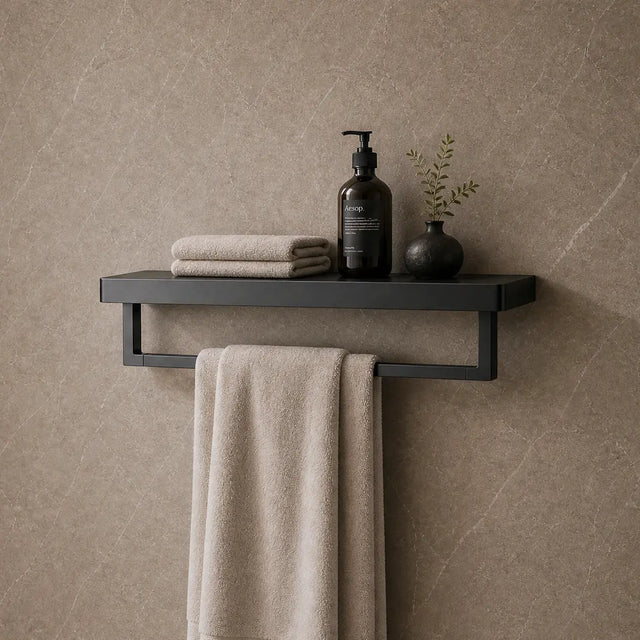 Bathroom interior with a shelf holding towels and toiletries against a tiled wall.