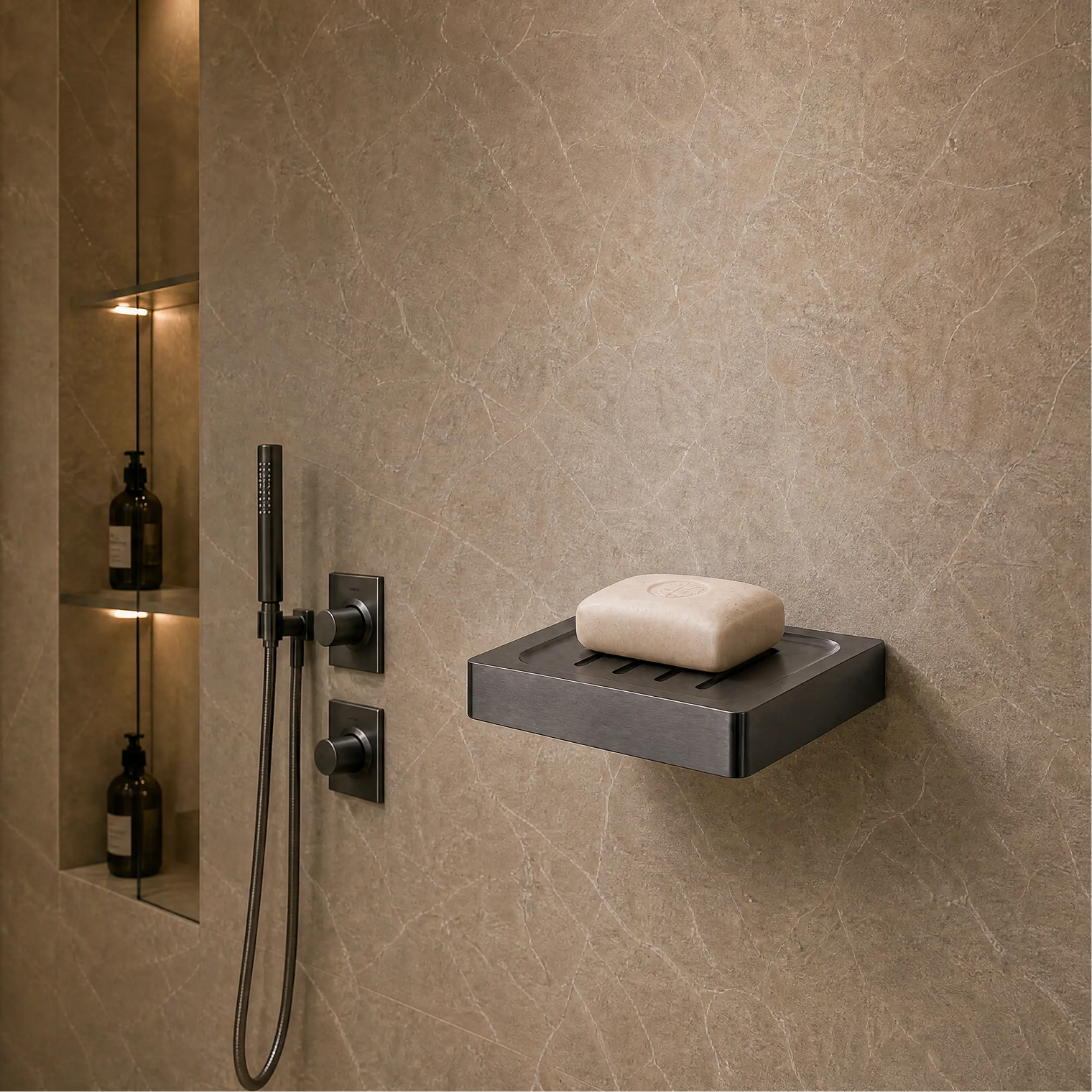 Modern bathroom shower area with soap dish and toiletries.