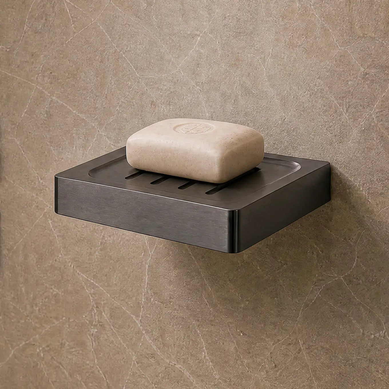 Modern bathroom shower area with soap dish and toiletries.