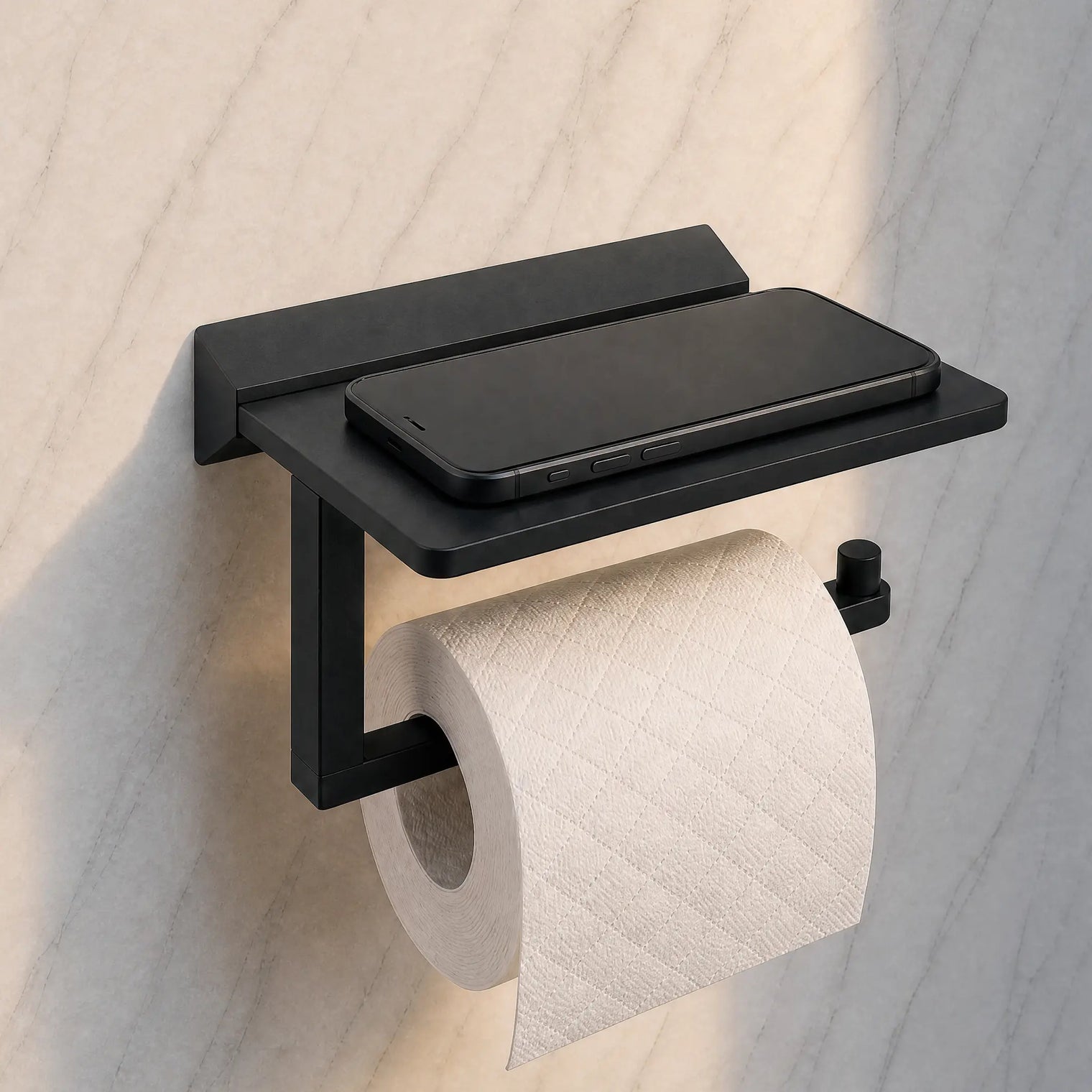 Black wall-mounted toilet paper holder with a roll of toilet paper on a light wooden background