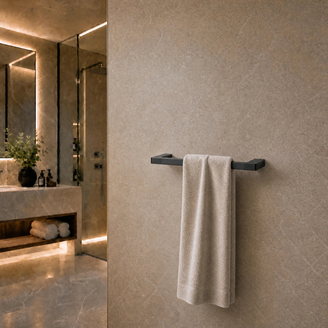 Towel hanging on a rack in a modern bathroom with neutral tones.