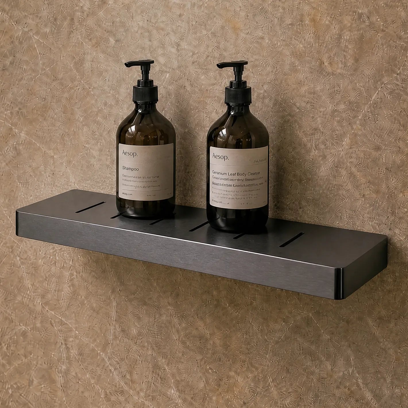 Bathroom with shower setup and two bottles on a shelf.