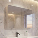 Modern bathroom with marble walls and a white vanity unit.