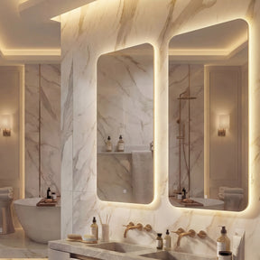 Luxurious bathroom with marble walls, a sink, and various toiletries.